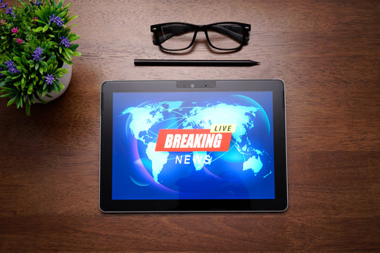 Breaking news live with worlmap background on PC Tablet screen