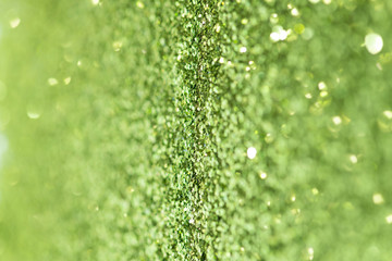 Wall Mural - Shiny green glitter textured background