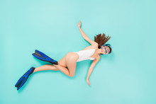 Full Length High Angle Above Flat Lay Photo Of Funky Lady Swimming Fast Ocean Water See Coral Reef View Using Flippers Tube Mask Wear Bodysuit Isolated Pastel Teal Color Background