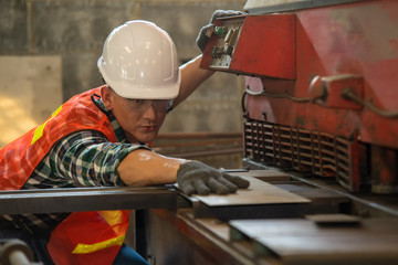 Poster - Worker in uniform operating in manual lathe in metal industry factory,Industry,Engineer,Construction concept.