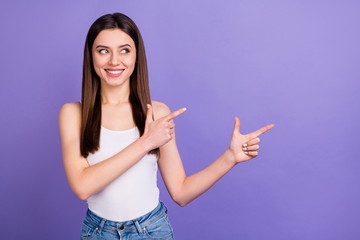 Wall Mural - portrait of positive cheerful girl promoter point index finger copyspace demonstrate ads promo recom