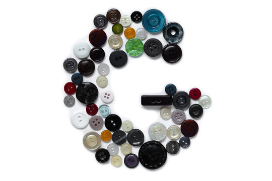 Letter G design made from clothing elements.