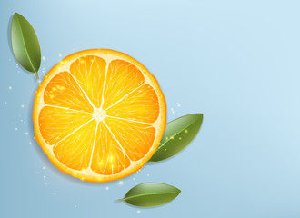 Slice of ripe orange with green leaves.