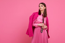Fashion Model In Magenta Jacket, Pink Skirt And Shirt.