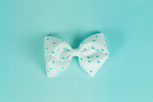 Close-up Of Bow Tie Against Turquoise Background