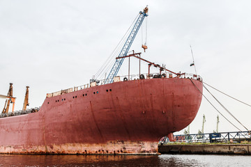 Red stern of a big industrial cargo ship, Varna port