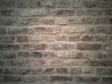 Closeup On A New Built Brick Wall. Warm Evening Light Coming From The Left.