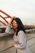 © Martisz Media - A young beautiful girl poses on an old bridge.