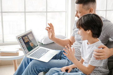 Wall Mural - Family video chatting at home