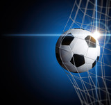 Fototapeta Pokój dzieciecy - soccer ball in goal with spotlight
