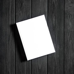 Mockup of closed blank square book at white textured paper