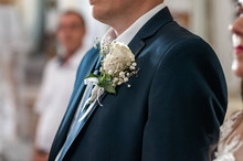 White Boutonniere On The Blue Jacket