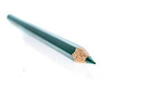 Close-up Of Green Colored Pencil Over White Background