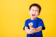 © sorapop - kid cute little boy attractive laugh smile playing holds and eating sweet chocolate ice cream waffle cone