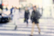© jokerpro - Blurry abstract background image of people walking on busy street