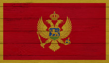 Montenegro Flag On A Wooden Texture. Wood Texture, Planks Wooden Texture Background Flag. Flag Painted With Paints On Wood
