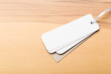 Blank tag, label blank mockup template on a wooden background