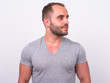 © Ranta Images - Portrait of muscular bearded man thinking and looking away