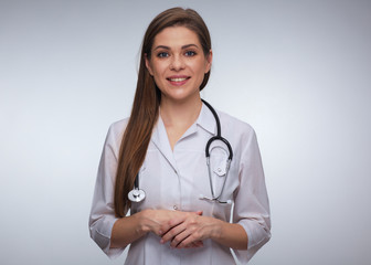 Isolated studio portrait of smiling woman doctor