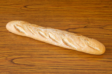 loaf of wheat bread on wooden table