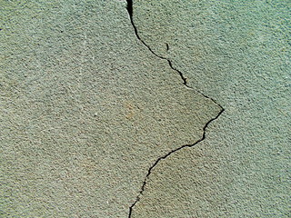 
Crack in the wall of the building. Blurred defocused background for web design.