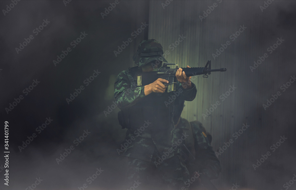 Special forces. soldier assault rifle with silencer. sniper in the ...