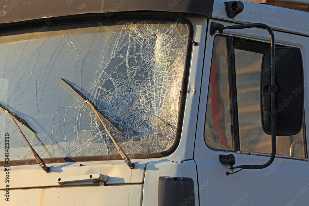 Windshield Gunshot Broken windshield of a truck (lorry). Accident and traffic accident ...