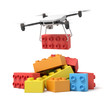 © gearstd - 3d rendering of quadcopter delivering huge red toy block and putting it on pile of other toy blocks on white background.