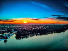 Panoramic Aerial View: Beautiful Spring Landscape: The Irtysh River In Kazakhstan Wakes Up From Winter Sleep - Ice Drift - Snow And Ice Are Melting At Sunset