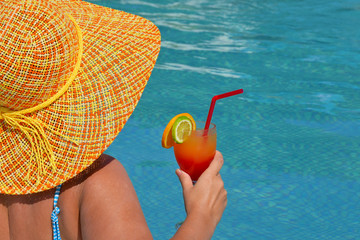 Real female beauty relaxing in swimming pool