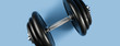 © Screaghin - Professional dumbbell and weight plates over blue background. Gym equipment. Fitness concept.