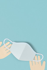 Hands with a face mask on a blue background social banner illustration