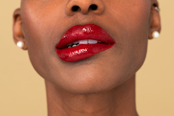 Black woman biting her red lips