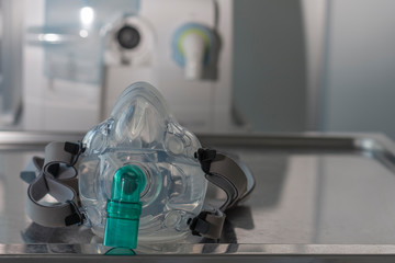 non-invasive ventlation face mask, on background medical ventilator in icu n hospital.