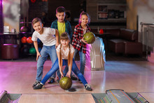 Little Children Playing Bowling In Club