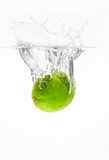 Fototapeta Łazienka - Falling of fresh lime into water against white background