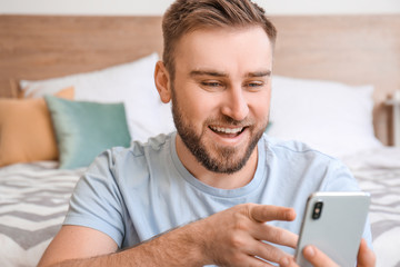 Sticker - Young man with mobile phone video chatting at home