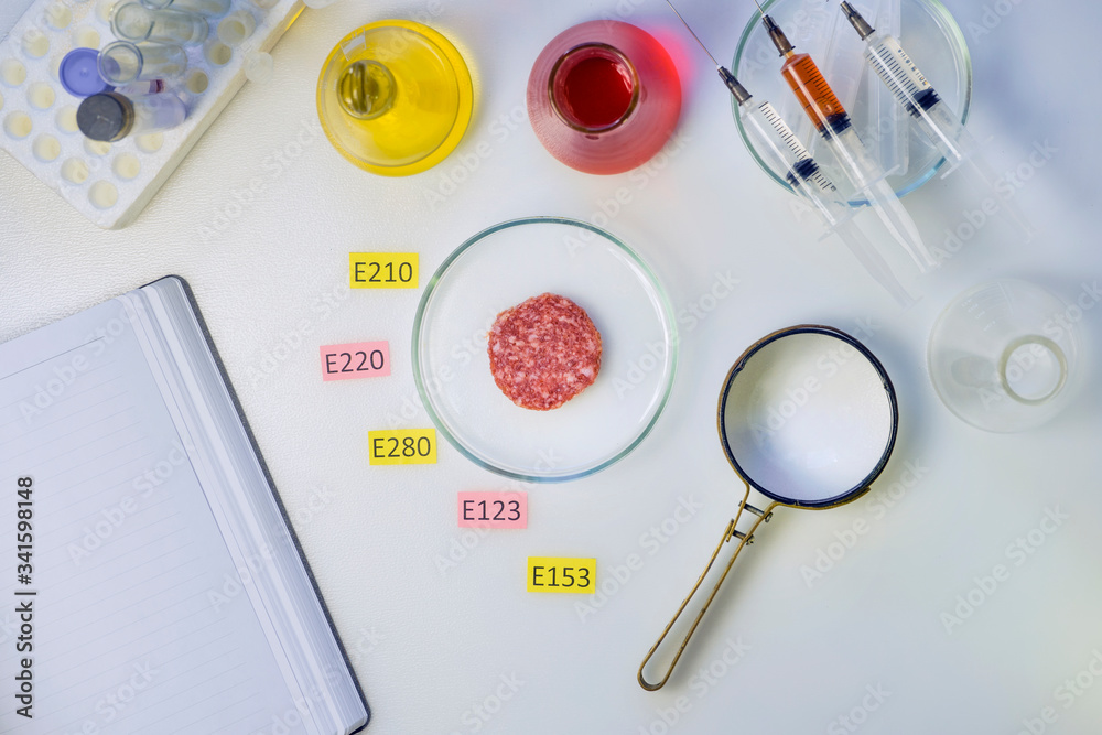 Healthy eating concept. A magnifier is on the laboratory s table, a ...