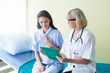 © eakgrungenerd - Doctor and patient woman discussing something health care in room of hospital, health care concept.