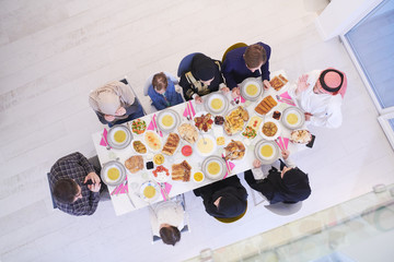 Wall Mural - muslim family having a Ramadan feast top view