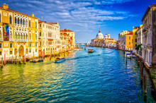 Grand canal and Basilica Santa Maria della Salute, Venice, Italy. Beautiful view on boats and vaporetto in Grand canal