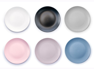 Set of six colorful empty plates isolated on white background top view. White, Black, Grey, Pink, Purple and Navy Blue empty plates collection