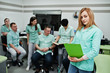 © AS Photo Family - Medical theme .Portrait of female doctor with clipboard against group of doctors meeting in the mri office at diagnostic center in hospital.