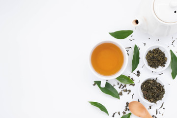 Wall Mural - cup with tea and teapot on white background, over light
