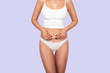 © Alexplanb - Young, healthy and beautiful blonde woman in white lingerie. Sport, fitness, diet, weight loss and healthcare concept. Slim female belly, girl holding her skin for cellulite check.