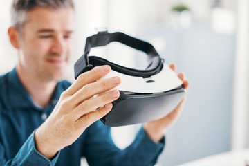 man holding a vr viewer