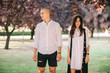 © jul14ka - A porttret of a young caucasian stylish couple walking on beautiful park