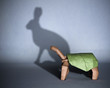 Concept of hidden potential. A paper figure of a turtle casting a shadow of a rabbit. 3D illustration