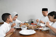 © Odua Images - happy muslim asian family having sahoor or sahur breakfast during ramadan