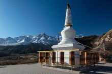 White Buddhist Stupa And Tibetan Prayer Wheels At Mati Temple Scenic Area, Zhangye, Gansu Province, China
